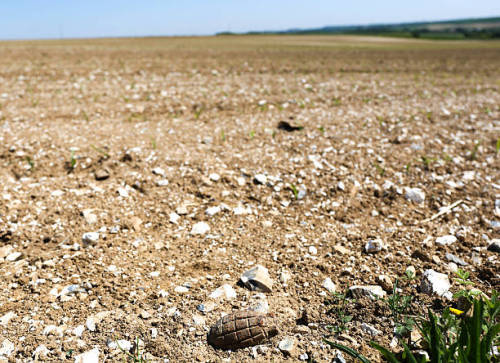 theworldofwars:An unexploded hand grenade sits on top of a farmers field, tens of millions of unexpl