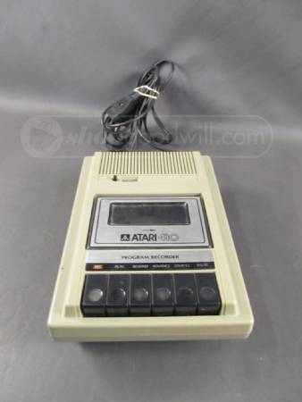 cassetteplayers:  Atari 410 Program Recorder Cassette Recorder. The REC button will not push down, and it does not move on play, the rewind, advance and stop/eject functions seem to work. Model 410 - measures 6.5" x 9.5" 