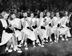 inthedarktrees:  Time out, ca. 1940s Newtown High School cheerleaders take a time out during a game with Port Richmond High at Madison Square Garden.   I want to live in the past