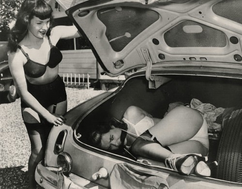 Bettie in a bra sneaking a friend with her panties showing to the Drive-In!