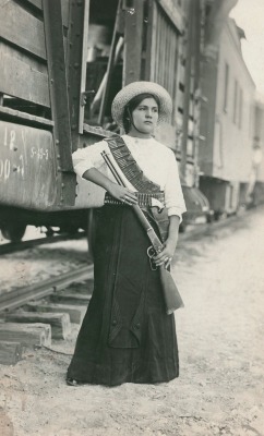 historicaltimes:  A female Mexican soldier before leaving the battle in Mexican Revolution via reddit