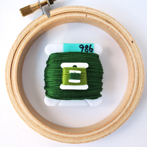 firesidetextiles:Small embroidery bobbin charms plus an extra tiny bobbin with matching hoop and sci