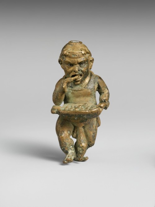 Ancient Greek or Roman bronze statuette of a dwarf with silver eyes.  Artist unknown; 1st cent. BCE/