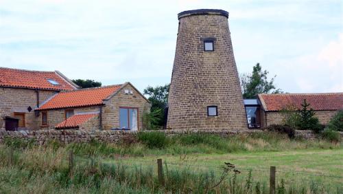 Beacon Windmill, Ravenscar, North Yorkshire, England.Formerly known as Peak Mill it carries a date s