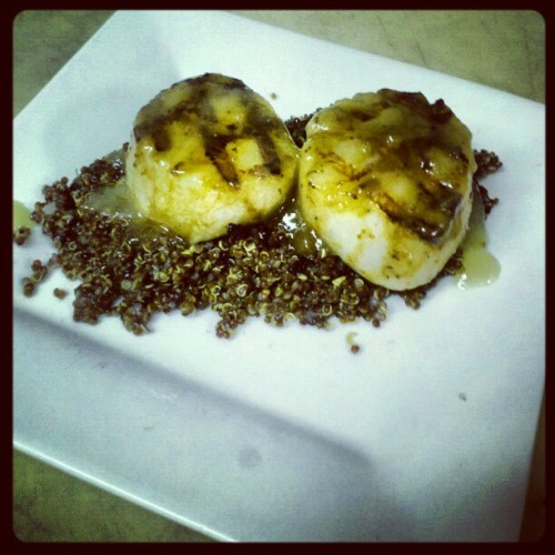 Grilled U10 scallops glazed in balsamic and topped with apple butter over a bed of quinoa. #slownigh