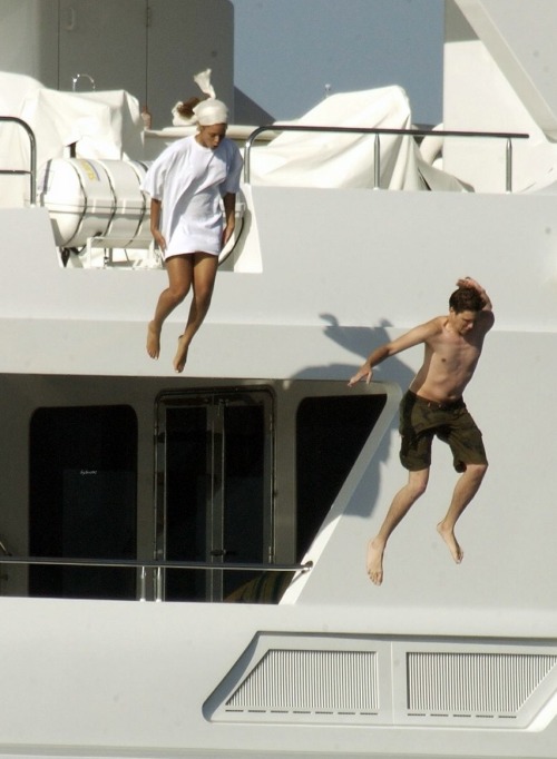 beyhive1992:   A recent photo from their New Year’s vacation in St. Barths shows Beyoncé jumping into the water off the bridge of a three-story, 14-foot yacht while Jay captures the moment with a video camera. It was a long way down. “Yeah it was,”