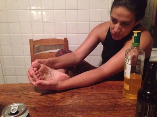 Victoria admiring her wrinkly bare sole.