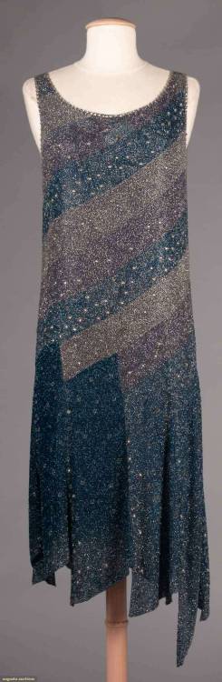 the1920sinpictures:1928 c. Blue and lilac diagonal beaded bands evening dress with an asymmetrical s