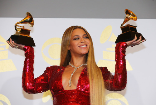 celebsofcolor: Beyonce poses with her Grammy trophies in the press room during the 59th Annual Gramm