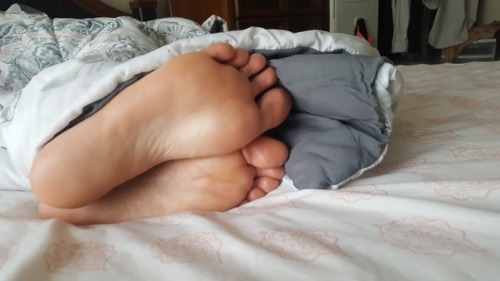 My fiancees gorgeous sleeping feet…