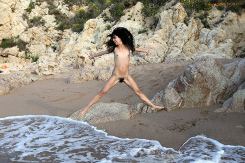 Naked Yana happy and playful on the beach with Daniel Bauer