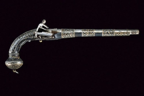 Ornate silver mounted miquelet pistol originating from the Caucuses, 19th century.