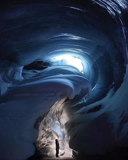 Gazing up at the ice formations of these spectacular ice caves ❄️ PC: @paulzizkaphoto #tentree ten t