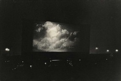 hauntedbystorytelling:Diane Arbus :: Clouds on Screen at a Drive-in Movie Theater, New Jersey, 1960 /  more [+] by this photographer   