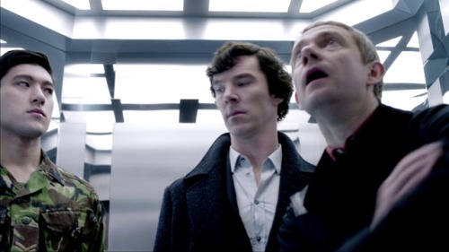 Sherlock and the corporal inspecting each other suspiciously whilst John being all “OMG L