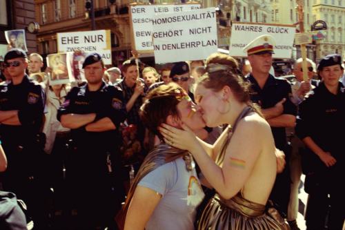 fuckyeahhardfemme:Kissing in front of the anti gay protesters at Vienna Pride.
