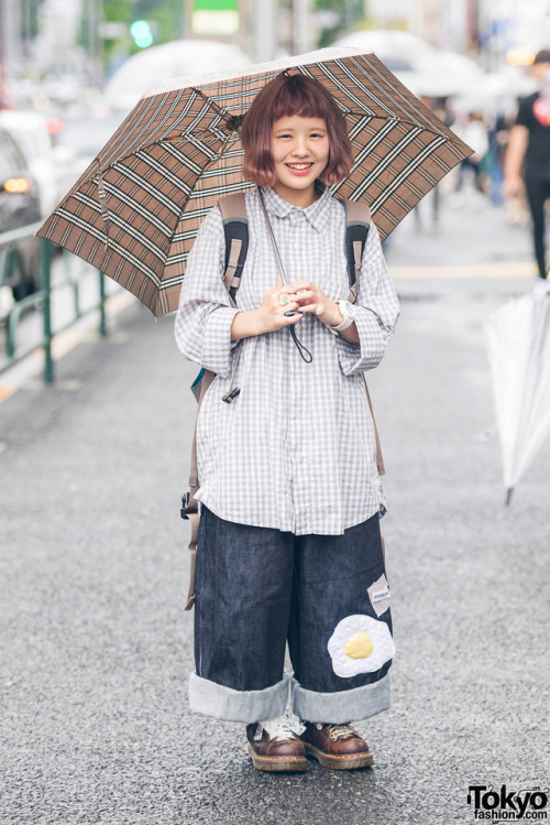 21-year-old Ayami on the street in Harajuku wearing a vintage checkered shirt with fried egg denim p