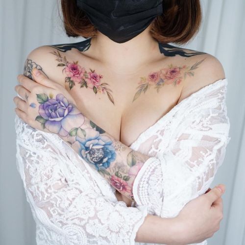 ig: tattooist_silo chest;flower;hand;portrait;rose