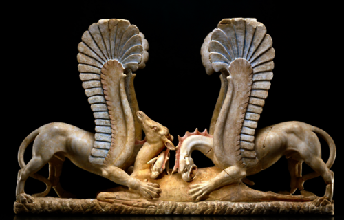 desimonewayland:Table pedestal (trapezophoron) in polychrome marble with two griffins devouring a de