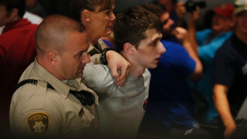 the-lianking:  tombruise:  congenitaldisease:  19-year-old Michael Sandford, a British man living in the U.S., was arrested on 19 June, 2016, after attempting to steal a gun from an officer while attending a    Donald Trump   rally. He explained that