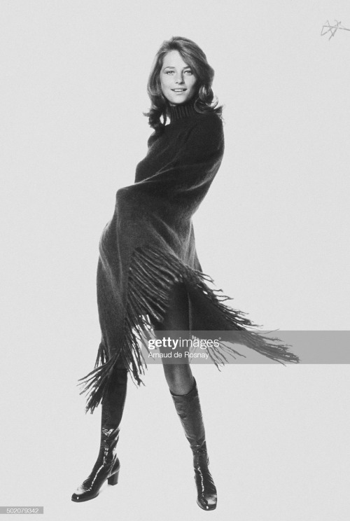 Vogue 1970. Charlotte Rampling wearing a knit poncho with long fringes and rolled neck by Emanuelle 