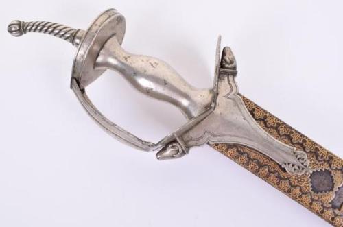 Gold inlaid khanda sword with silver basket hilt, India, 18th century.from C and T Auctioneers