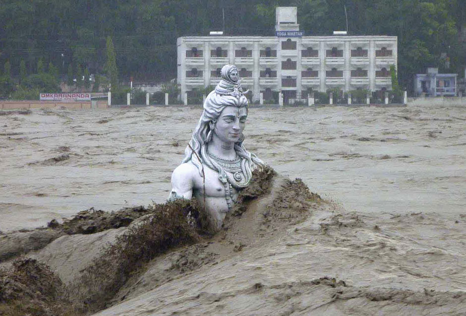  A submerged statue of the Hindu Lord Shiva amid the flood waters of the river Ganges,