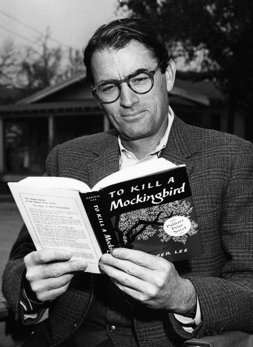 gregorypeck:  Gregory Peck reading his own copy of “To Kill a Mockingbird” while on set,