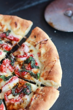 in-my-mouth:  Green Olive Pesto Pizza with Feta Stuffed Crust, Roasted Red Peppers and Balsamic Drizzle 