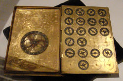 fistfuloffur:  a-tem-po-ral: 16th century French cypher machine in the shape of a book with coat of arms of Henri II