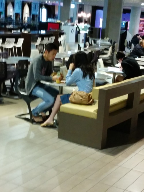 Asian couple at food court