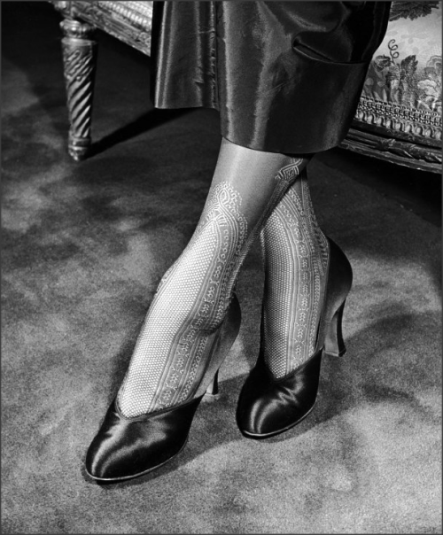 “Lace stockings with panels that run to mid-calf and enhance slim ankles,” 1948 Life mag
