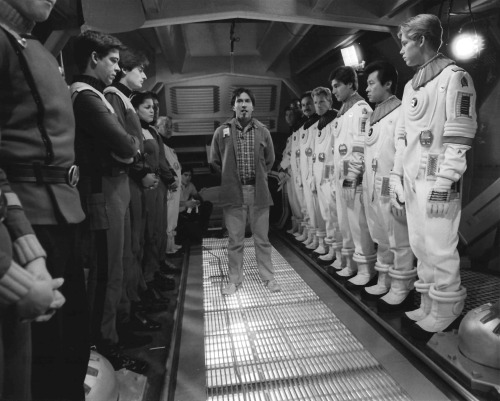 Director Nicholas Meyer (with trademark cigar) addresses a group of background players in the torped