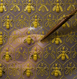 guerlain:  Constellation of 69 bees, the symbol of the Empire and the emblem of the Guerlain family of “Eaux”.Sylvie Deschamps, Maître d’art, handcrafts “The Festive Attire”, “L’Habit de Fête”, a covering designed as an imperial coronation