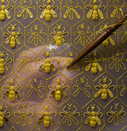 guerlain:  Constellation of 69 bees, the symbol of the Empire and the emblem of the Guerlain family of “Eaux”.Sylvie Deschamps, Maître d’art, handcrafts “The Festive Attire”, “L’Habit de Fête”, a covering designed as an imperial coronation