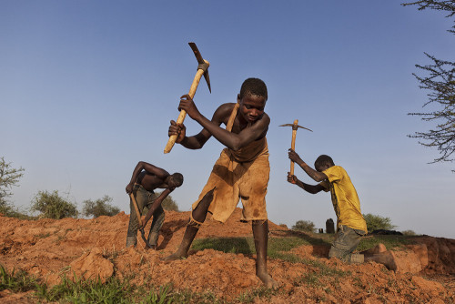 riggu:  Digging the Future by Matjaz Krivic“Yakuba (16) emerges from a 50m deep hole after another gruelling 14-hours work day underneath the panorama of western Burkino Faso. Last year his uncle and two of his friends died when a mine near by collapsed.
