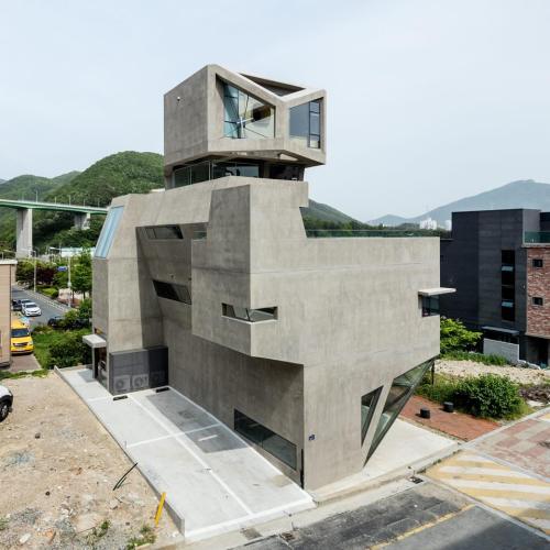 Moon Hoon&rsquo;s concrete housing block in South Korea has owl-like features via dezeen