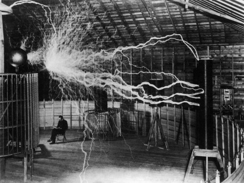 crimsonkismet: Nikola Tesla sitting behind his Magnifying Transmitter in his Colorado Springs labora