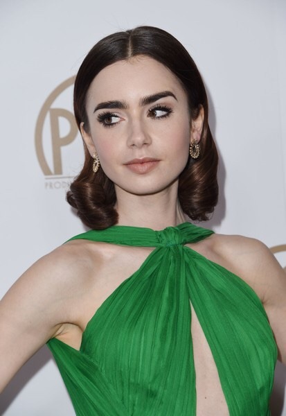 lilycollinsnews: Lily Collins attends the 28th Annual Producers Guild Awards at The Beverly Hilton H