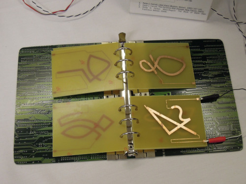 little-urban-witch: elektrik667: The Electronomicon is a book of seven printed-circuit-board (PCB) t