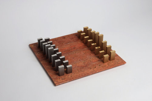 Tarek Elkassouf‘s chess setMaterial: Carrara marble board with Brushed Stainless Steel and Gun Metal