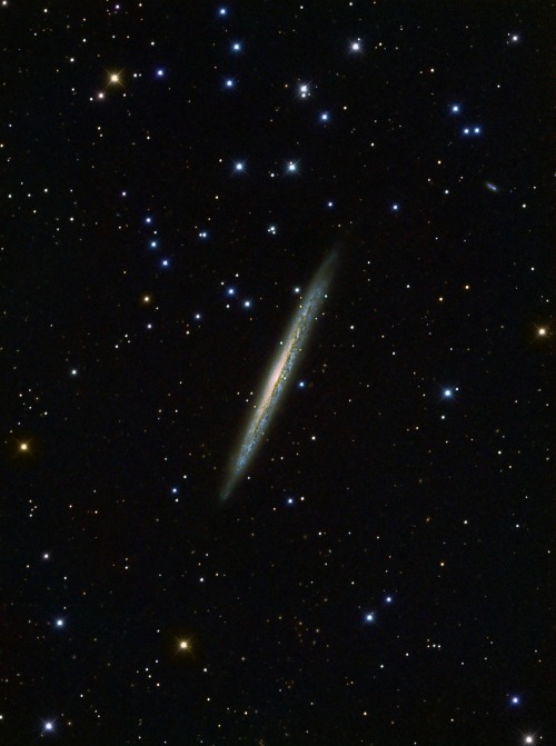 thedemon-hauntedworld:The Knife Edge Galaxy slices through deep space in this spectacular night sky 