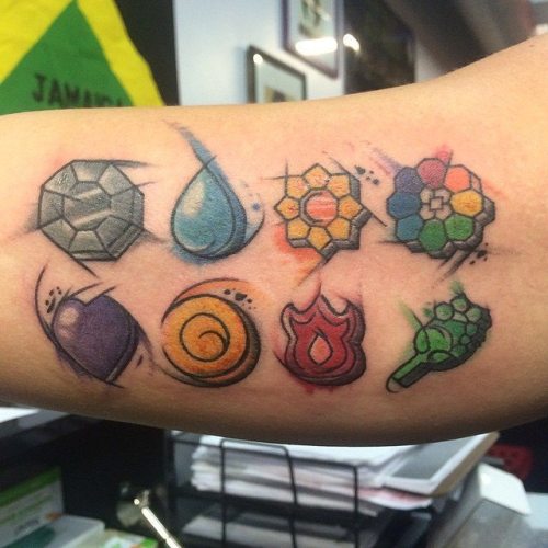 gamerink:Watercolor Pokemon badges tattoo done by @tattoosbyliat.