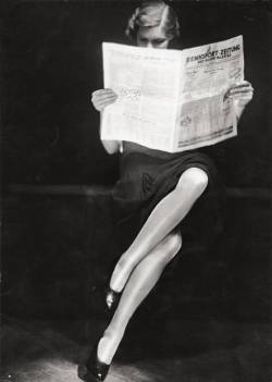  A lady reading newspaper, 1932. 