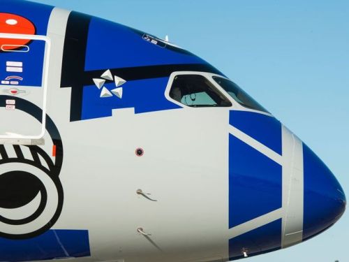 archatlas:  Boeing & ANA unveil R2-D2 Dreamliner Star Wars theme music played and Storm Troopers held guard as the hangar doors began to open. Within moments, a Boeing 787 “Dreamliner” painted with likeness of R2-D2 emerged to a cheering crowd