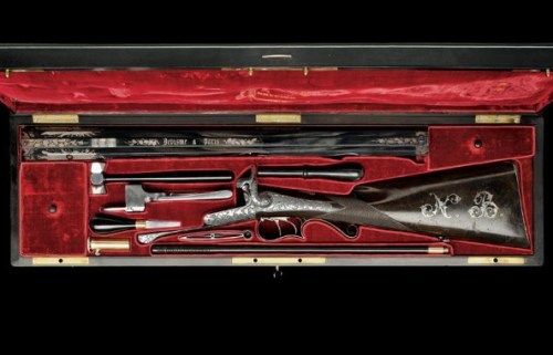 A Luxury Cased Garniture of silver decorated double barrel pinfire pistols and a double barrel pinfi