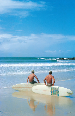 highenoughtoseethesea:   Russell Hughes and Bob McTavish at Noosa Main Beach, in Queensland, Australia, c. 1966.    Photo by John Witzig, as featured in the article for The New Yorker spotlighting his book,  A Golden Age: Surfing’s Revolutionary 1960s