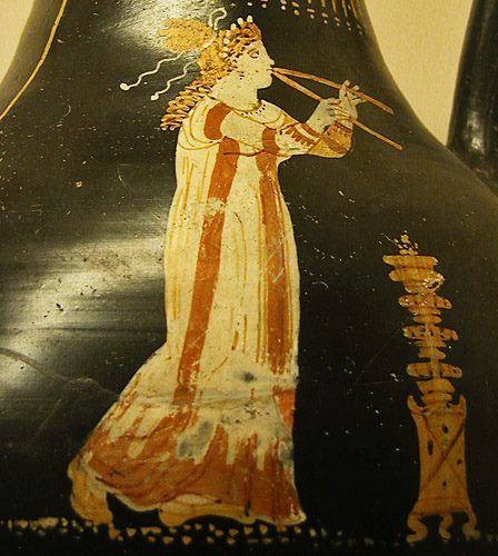 hellenismo:Entertainer plays double pipes beside an incense burner. Southern Apulia, 330 BCE. London