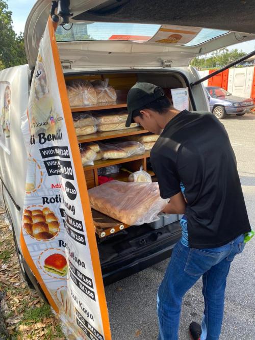 The roti man is busy working from his van.Shah Alam, Malaysia.