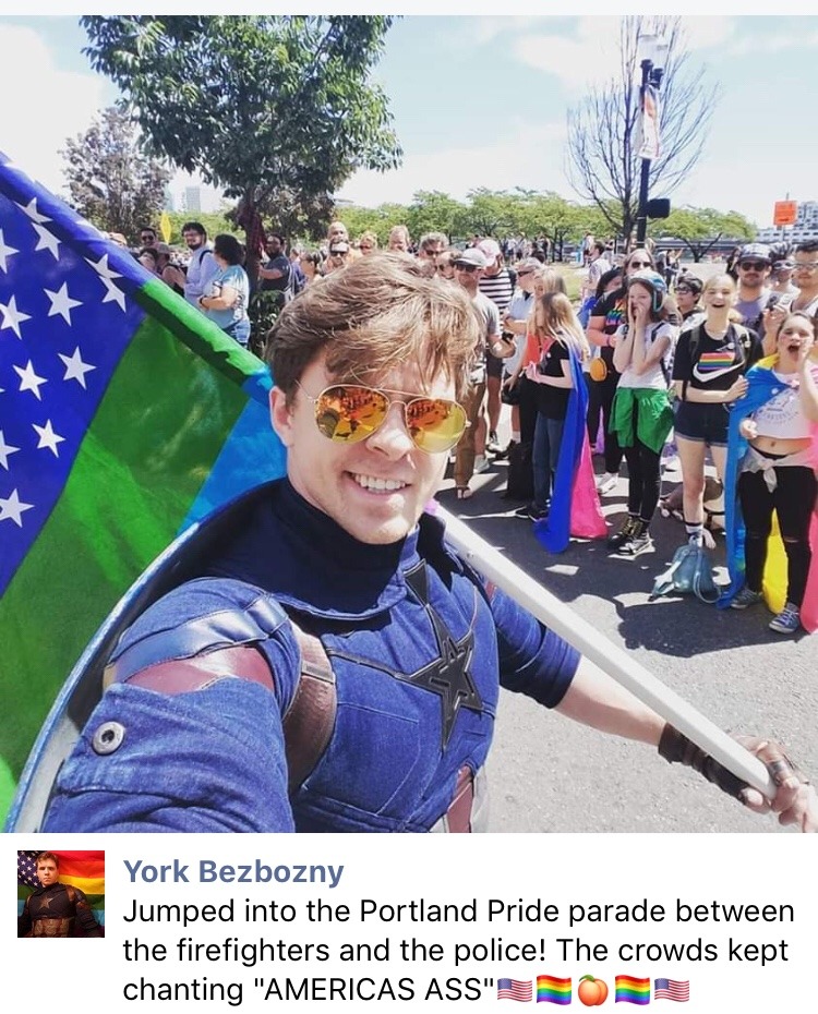 starcaptainyork:  nezumiko:  crewdlydrawn: mystrangedarkson:  nezumiko:  EPIC Photo from Portland Pride 2019 © The Oregonian [Photograph of a man dressed as Captain America, from behind with his shield on his back, waving a rainbow-striped American flag]